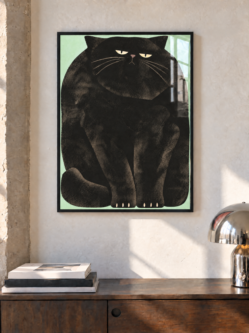 I Wish I Fit In black cat print shown in a black frame above a wooden cabinet in a room mockup