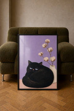 Framed Still Life art print leaning against an olive-green corduroy armchair on a wooden floor